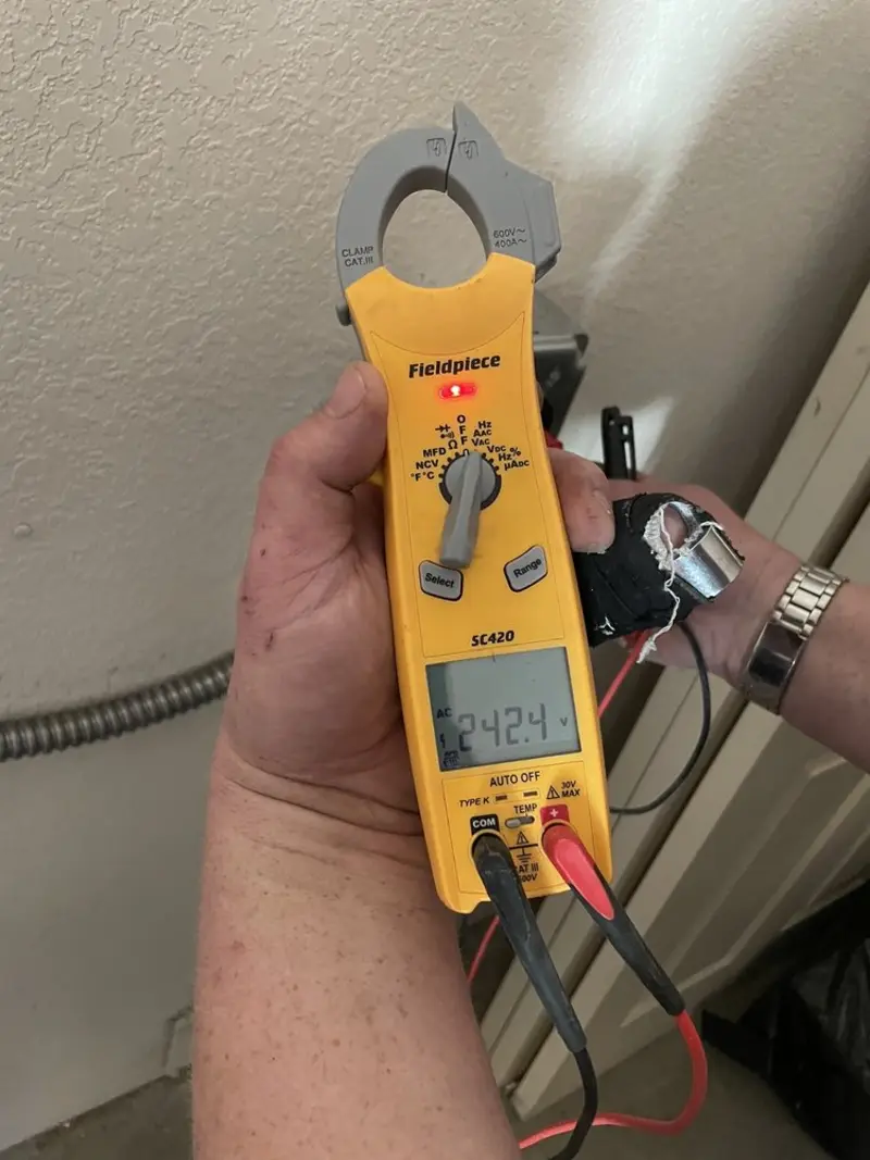 Voltage testing with clamp meter during Recessed Lighting Installation in Laureldale